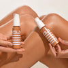 Efeito do iluminador glow corporal da Ollie sob pernas bronzeadas em fundo branco.